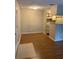Neutral living area with wood floors and view of kitchen bar at 238 Afton Sq # 106, Altamonte Springs, FL 32714