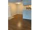 Neutral living area with wood floors and view of kitchen bar at 238 Afton Sq # 106, Altamonte Springs, FL 32714