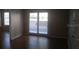 Living room with hardwood floor and sliding glass doors at 238 Afton Sq # 106, Altamonte Springs, FL 32714