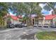 Complex with parking lot and green landscaping and lots of trees at 238 Afton Sq # 106, Altamonte Springs, FL 32714