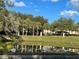 Community Pond with birds, beautiful plants, and gazebo on a bright sunny day at 238 Afton Sq # 106, Altamonte Springs, FL 32714