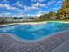 Community pool overlooking the lake, perfect for relaxing and enjoying the sunshine at 238 Afton Sq # 106, Altamonte Springs, FL 32714