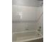 Clean bathroom featuring a white tiled shower and tub at 238 Afton Sq # 204, Altamonte Springs, FL 32714