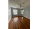 Cozy bedroom with natural light, ceiling fan, and continuous wood flooring at 238 Afton Sq # 204, Altamonte Springs, FL 32714
