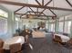 Spacious clubhouse featuring high ceilings, ceiling fans, dining tables, and comfortable seating arrangements at 238 Afton Sq # 204, Altamonte Springs, FL 32714
