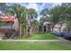 Apartment building exterior with lush landscaping and ample parking at 238 Afton Sq # 204, Altamonte Springs, FL 32714