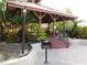 Community gazebo with red roof, grilling area, and lush landscaping at 238 Afton Sq # 204, Altamonte Springs, FL 32714