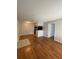 The open-concept layout features a living room looking towards a kitchen space, with wood flooring at 238 Afton Sq # 204, Altamonte Springs, FL 32714