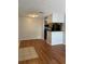 Open-concept living area with tile and wood flooring, transitioning to the kitchen area at 238 Afton Sq # 204, Altamonte Springs, FL 32714