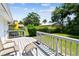 Back deck with patio seating overlooking lush backyard with detached garage at 2505 Amherst Ave, Orlando, FL 32804