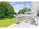 Back deck with patio seating overlooks a spacious fenced backyard with lush landscaping at 2505 Amherst Ave, Orlando, FL 32804