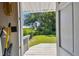 View of the backyard with a shed through an open door with a white deck at 2505 Amherst Ave, Orlando, FL 32804