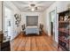 Bright dining area with hardwood floors, a vintage table set, and access to other rooms in the house at 2505 Amherst Ave, Orlando, FL 32804