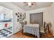 Charming dining area featuring hardwood floors, a table with a decorative cover, and a view into the adjacent kitchen at 2505 Amherst Ave, Orlando, FL 32804