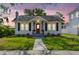 Charming home exterior with manicured lawn, flower beds and classic architecture at 2505 Amherst Ave, Orlando, FL 32804