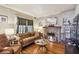 Cozy living room with a brick fireplace, hardwood floors, and natural lighting at 2505 Amherst Ave, Orlando, FL 32804