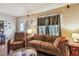Living room featuring hardwood floors, comfortable seating, and a large window at 2505 Amherst Ave, Orlando, FL 32804