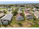 Aerial view showcases this property's backyard, screened lanais, neighboring homes, and ponds at 2506 Aster Cove Ln, Kissimmee, FL 34758