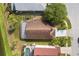 Aerial view of the home with a screened-in pool and large backyard at 2506 Aster Cove Ln, Kissimmee, FL 34758