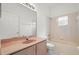 Bathroom featuring a vanity, tub, and shower at 2506 Aster Cove Ln, Kissimmee, FL 34758