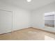 Bedroom featuring a closet, tile floors and window at 2506 Aster Cove Ln, Kissimmee, FL 34758