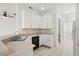 Bright kitchen with white cabinetry, modern appliances, and tile flooring at 2506 Aster Cove Ln, Kissimmee, FL 34758