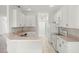 Well-lit kitchen with white cabinetry, modern appliances, and ample counter space at 2506 Aster Cove Ln, Kissimmee, FL 34758