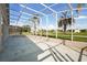 Open screened lanai perfect for outdoor entertaining, offering views of backyard at 2506 Aster Cove Ln, Kissimmee, FL 34758