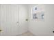 Laundry room with a window and door at 2506 Aster Cove Ln, Kissimmee, FL 34758