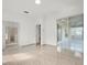 Spacious living room featuring tile floors and sliding glass doors to an enclosed patio at 2506 Aster Cove Ln, Kissimmee, FL 34758