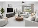 Bright living room with modern furnishings and a large sliding glass door at 2506 Aster Cove Ln, Kissimmee, FL 34758