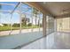 Bright, airy screened patio with tile floor offering scenic outdoor views at 2506 Aster Cove Ln, Kissimmee, FL 34758