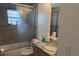 Standard bathroom with a shower-tub combo, vanity, and marble countertop at 2514 Dovetail Dr, Ocoee, FL 34761