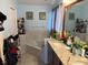 Bathroom featuring a corner tub, double vanity, and tiled backsplash at 2514 Dovetail Dr, Ocoee, FL 34761