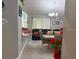 A bright and open living and dining area with stylish furniture, neutral paint and tile floors creating a cozy space at 2514 Dovetail Dr, Ocoee, FL 34761