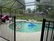 Screened-in pool area with patio furniture and a dolphin float at 2514 Dovetail Dr, Ocoee, FL 34761