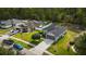 Aerial view of a home in a neighborhood, showcasing its landscaping and spacious driveway at 3422 Heath Dr, Deltona, FL 32725