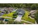 Desirable neighborhood features a gray home with a two-car garage, lawn, and suburban setting at 3422 Heath Dr, Deltona, FL 32725