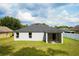 Exterior showcasing a well-maintained yard, screened patio, and great backyard space at 3422 Heath Dr, Deltona, FL 32725