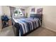 A comfortable bedroom with a large window, perfect for relaxation at 3422 Heath Dr, Deltona, FL 32725