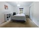 A cozy bedroom features neutral carpet, a closet, and a window for natural light at 3422 Heath Dr, Deltona, FL 32725
