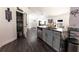 Bright kitchen features gray cabinets, granite countertops, stainless steel appliances, and an oversized pantry at 3422 Heath Dr, Deltona, FL 32725
