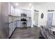 Beautiful kitchen with stainless steel appliances, granite countertops, gray cabinets and modern flooring at 3422 Heath Dr, Deltona, FL 32725