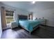 Spacious main bedroom with wood floors, ensuite bathroom, and large windows at 3422 Heath Dr, Deltona, FL 32725