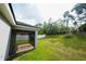 Inviting screened patio that leads to a spacious backyard with mature trees, offering privacy at 3422 Heath Dr, Deltona, FL 32725