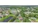 Aerial view of a neighborhood entrance featuring lakes and lush landscaping at 4394 Devon Ct, Kissimmee, FL 34746