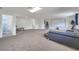 Spacious finished basement featuring a large entertainment area with projector screen and an adjacent bathroom at 4394 Devon Ct, Kissimmee, FL 34746