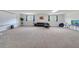 Bright and open finished basement space ideal for versatile use, with ample natural light from windows at 4394 Devon Ct, Kissimmee, FL 34746