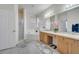 Well-lit bathroom featuring a shower, soaking tub, double sink vanity, and a linen closet at 4394 Devon Ct, Kissimmee, FL 34746
