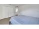 Carpeted bedroom with double closet at 4394 Devon Ct, Kissimmee, FL 34746